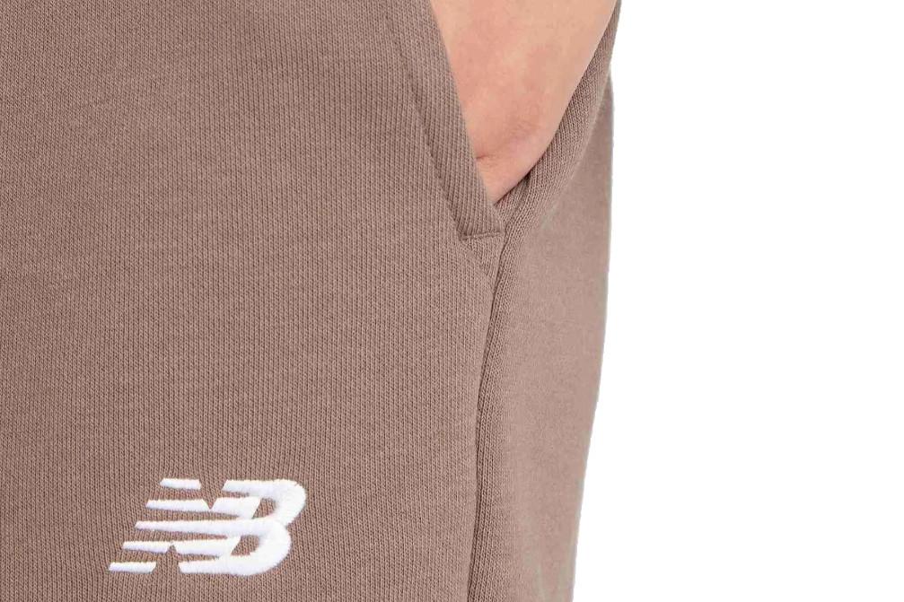 Pantalón largo New Balance Sport Essentials French Terry Jogger marrón mujer